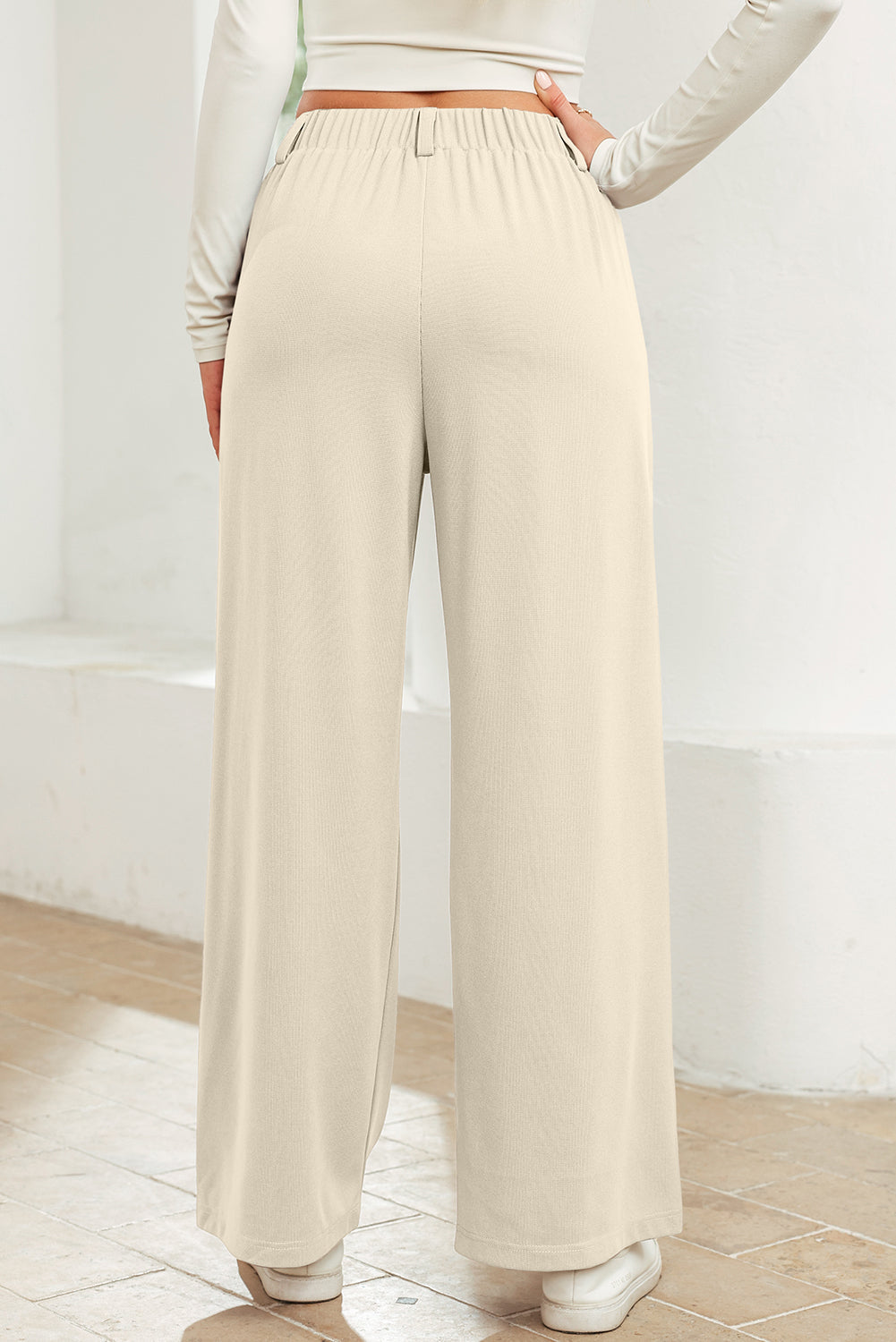 Pantalones de pierna ancha con cintura elástica y textura lisa